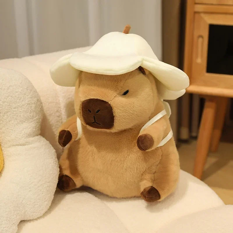Kawaii plush toy resembling a bear in a hat on a soft surface