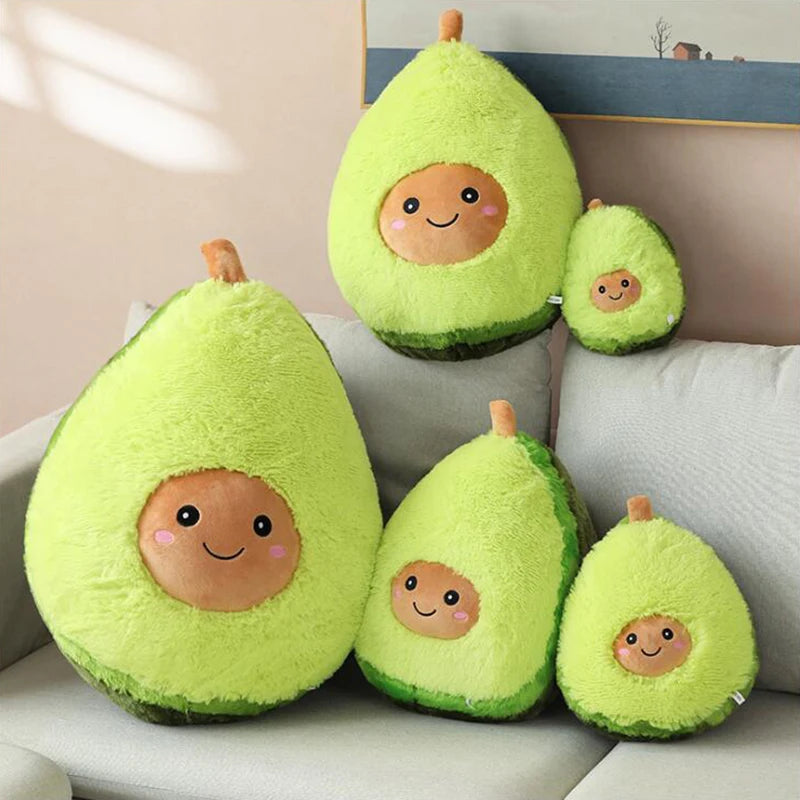 Set of avocado-shaped kawaii plush toys with smiling faces on a couch.