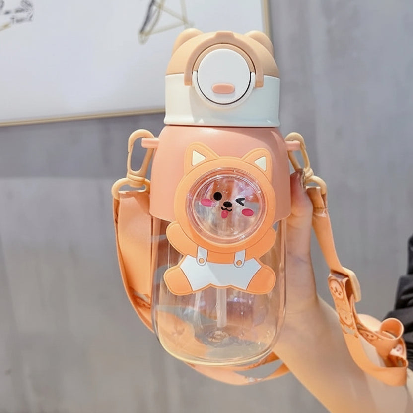 Cute orange kawaii water bottle with bear design held by a person against a neutral background