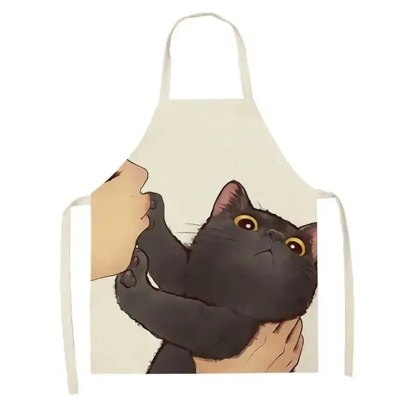 Kawaii apron with a design of hands holding a black cat on a beige background