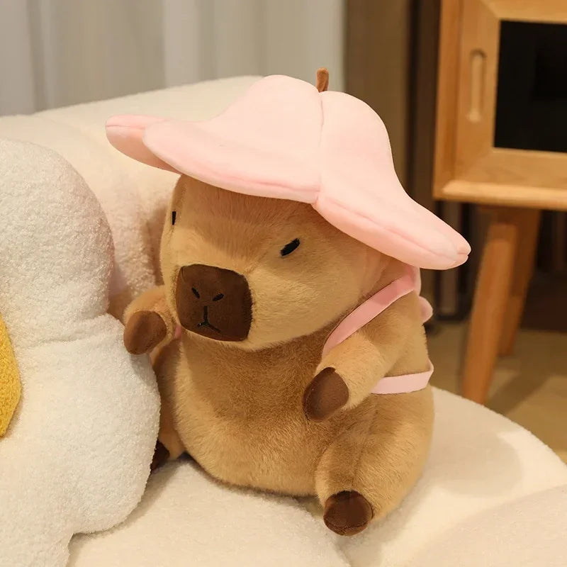 Kawaii plush toy resembling a bear with a pink flower hat on a soft surface