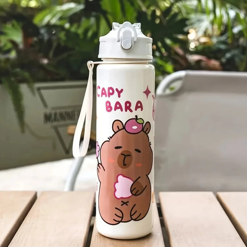 Capybara-themed kawaii water bottle on a wooden surface with a blurred background