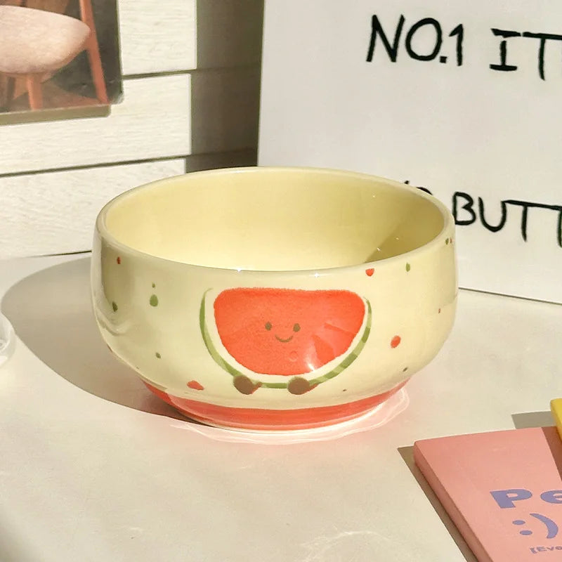 Ceramic kawaii bowl with a watermelon design on a light surface.