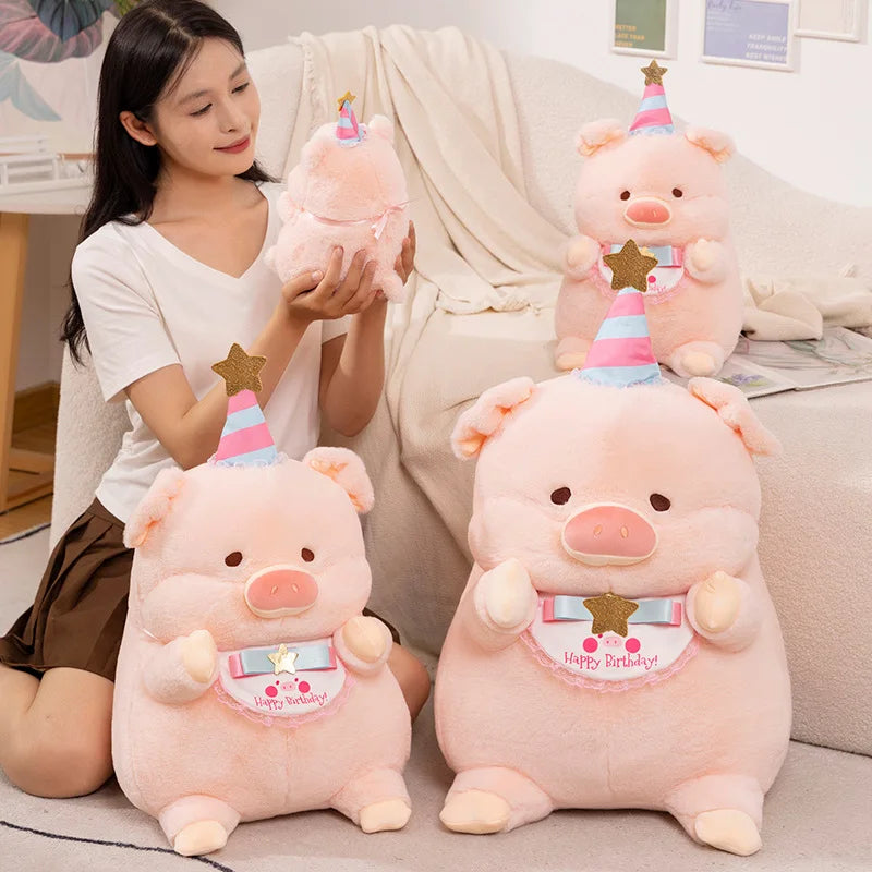 Woman holding a set of pink kawaii plush pigs with birthday hats on a couch.