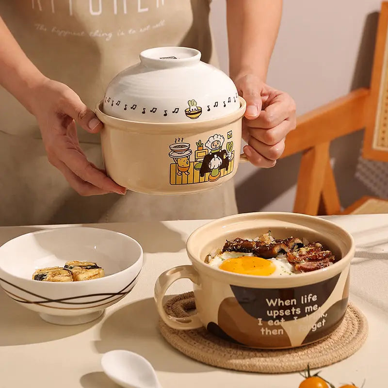Someone holding a large cartoon themed kawaii ramen bowl
