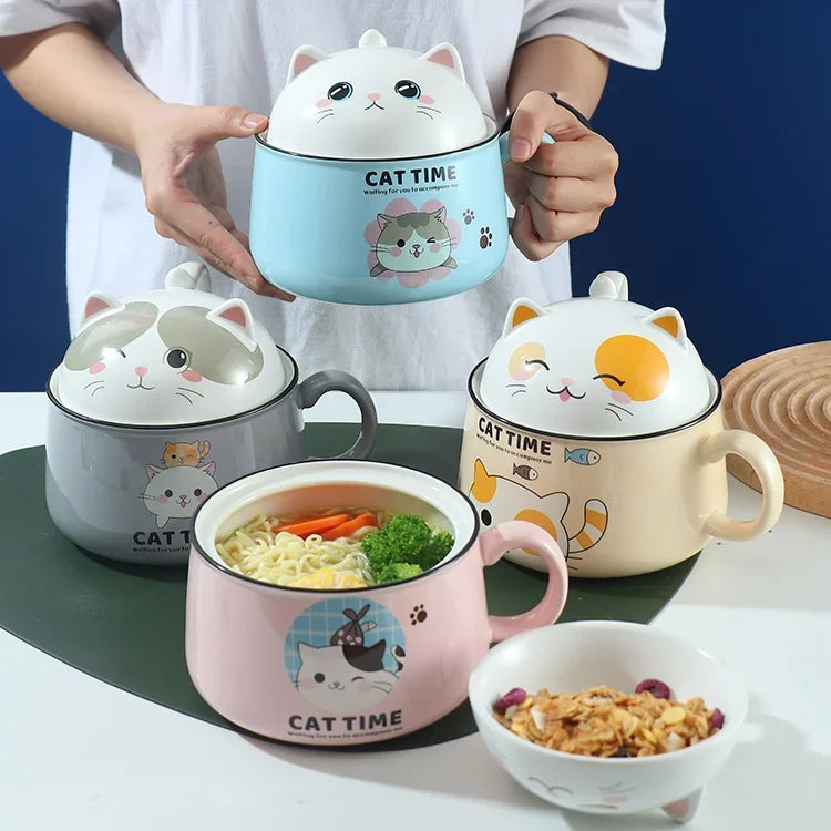Four kawaii ramen bowls with cat designs on a table