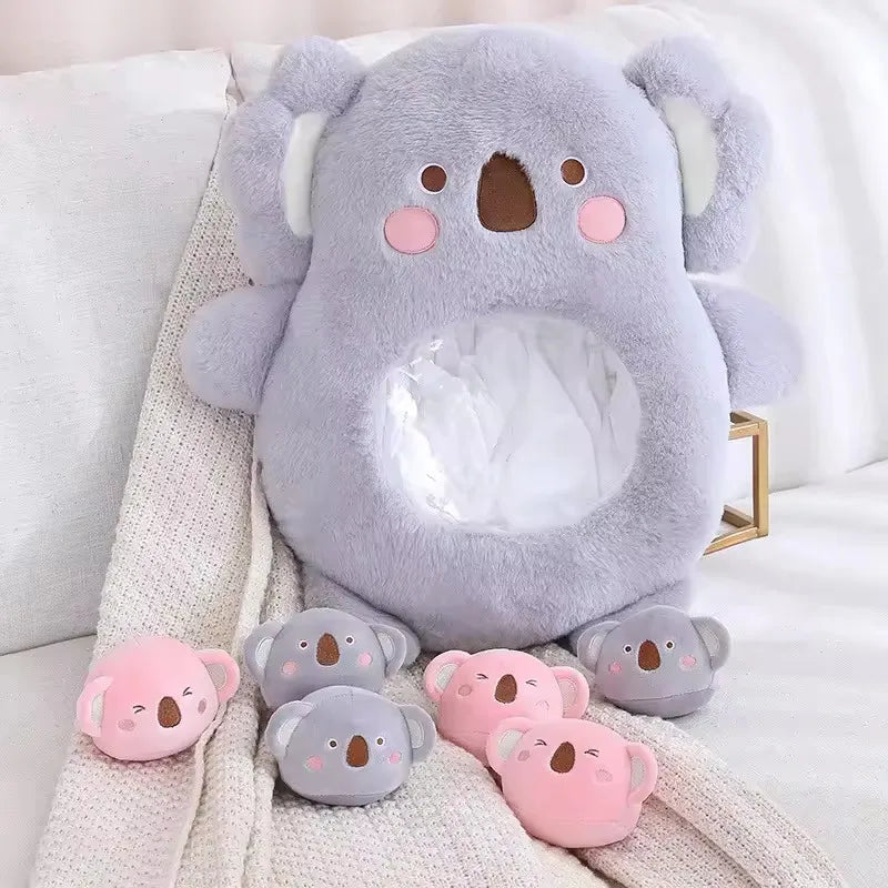 Kawaii plush koala toys in gray and pink on a soft surface