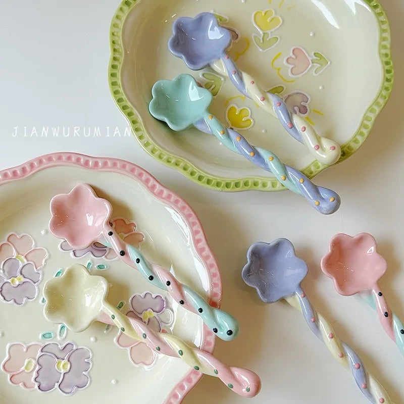 A set of rainbow colored kawaii spoons on plates