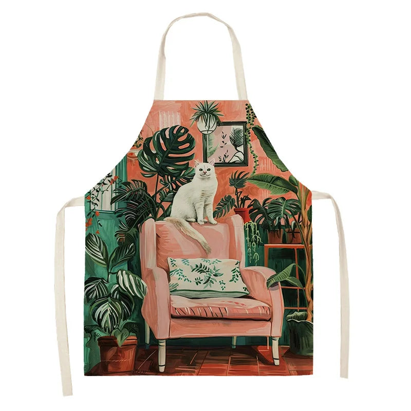 Kawaii apron with a design of a cat on a pink chair surrounded by plants