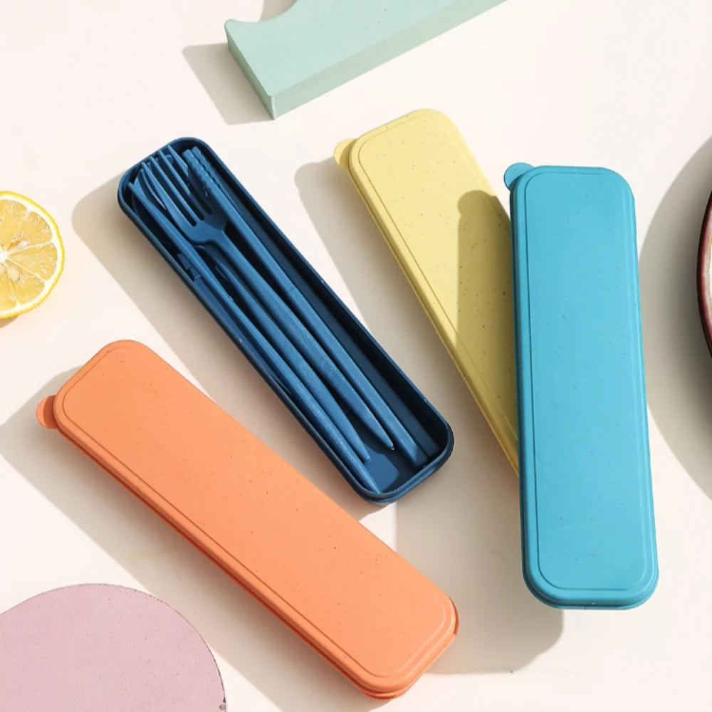Set of colorful silicone kawaii utensils cases on a light background