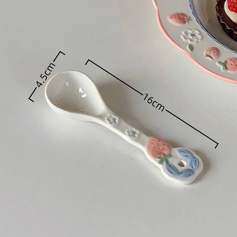 A white ceramic kawaii spoon on a table