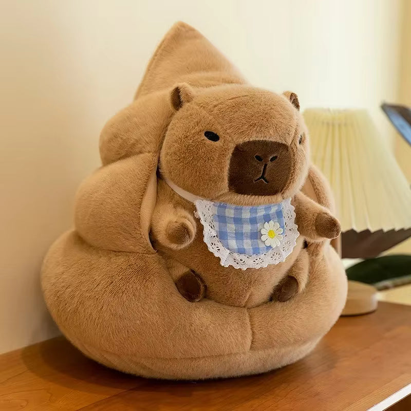 Kawaii plush toy shaped like a brown animal with a checkered bib on a wooden surface.