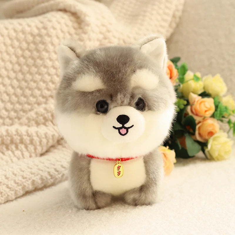 Kawaii plush toy dog with a red collar and yellow tag on a soft surface with flowers in the background