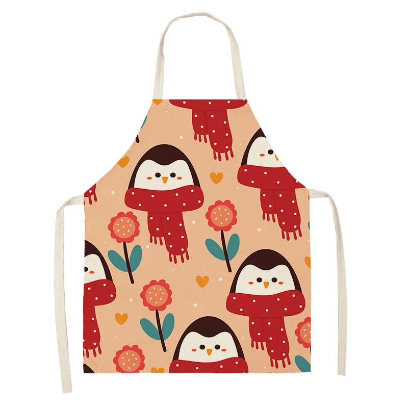 Apron with penguin Kawaii design wearing red scarves on a beige background