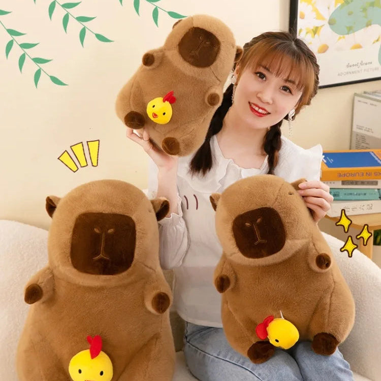 Person holding two brown kawaii plush toys with a cartoon face on a white couch.