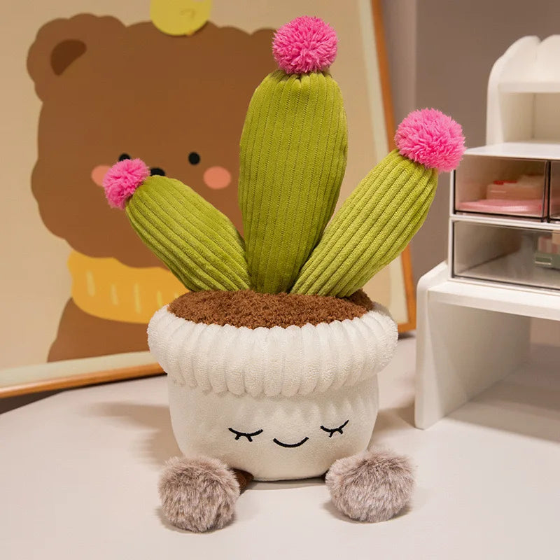 Plush cactus kawaii toy with pom-pom flowers on a white surface
