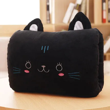 Black cat-shaped kawaii pillow with cute face design on a wooden surface.