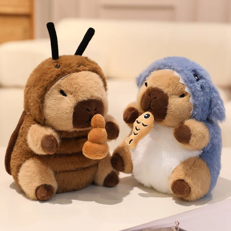 Two kawaii plush toys, one brown and one blue, sitting on a light surface.