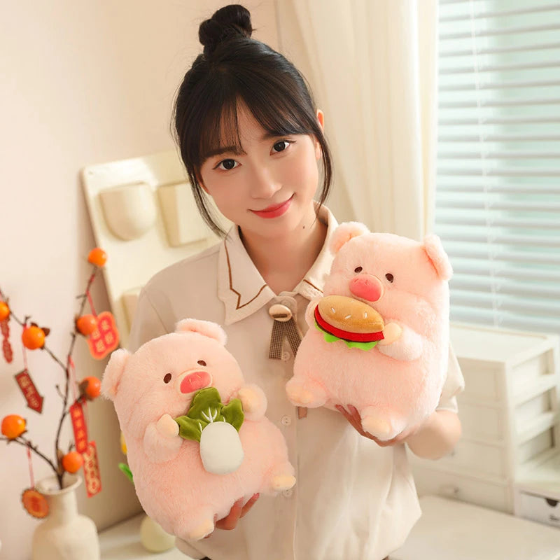 Person holding two pink kawaii plush toys with a neutral background