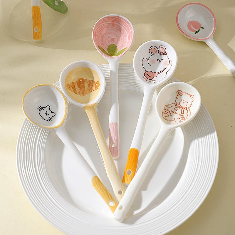 A set of kawaii spoons sitting on a plate
