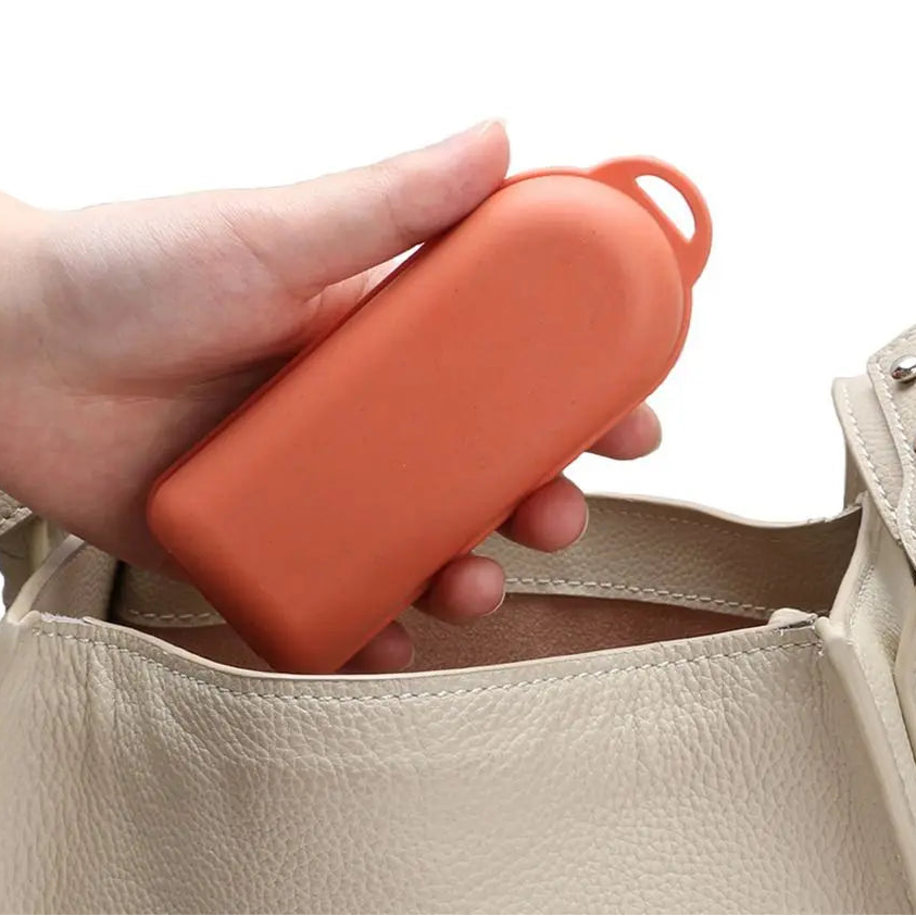 Hand holding an orange kawaii utensils next to a beige handbag with text 'Easy To Carry'.