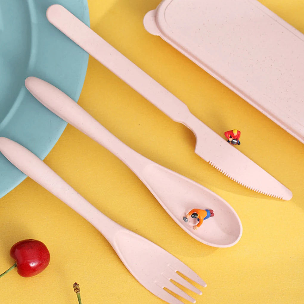 Set of pink kawaii utensils with a cherry and small figurine on a yellow background