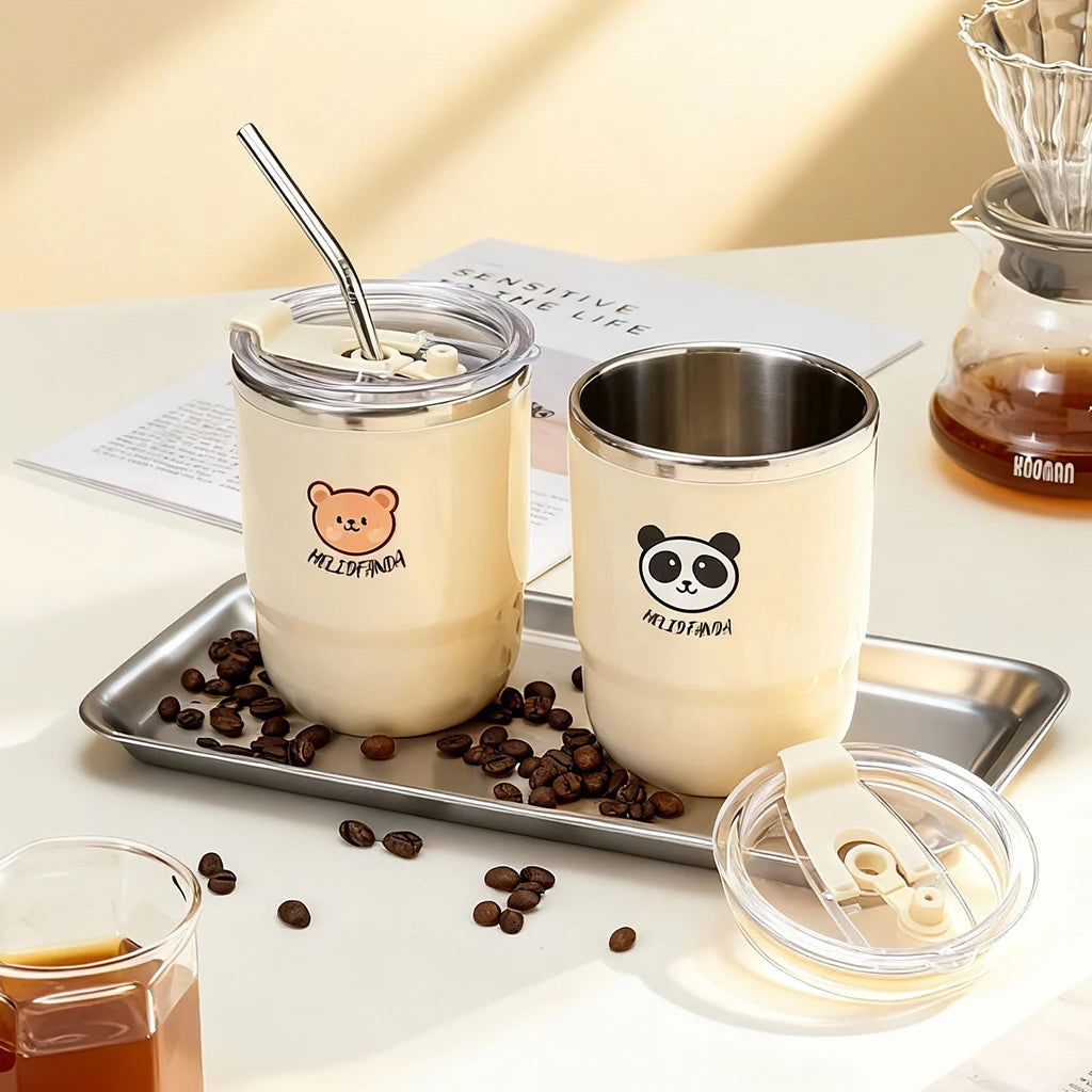Two bear-themed kawaii coffee cups with lids and straws on a tray with coffee beans, surrounded by coffee-related items.