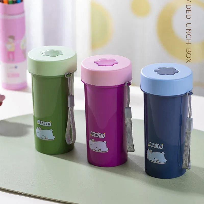 Three colorful kawaii water bottles with animal illustrations on a light surface.