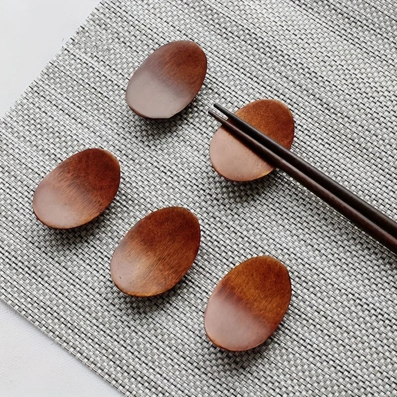 A set of five wooden kawaii chopstick holders