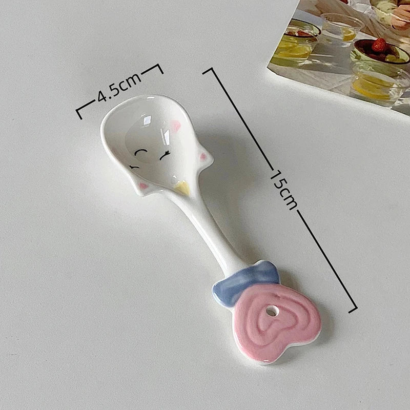 A white ceramic kawaii spoon on a table