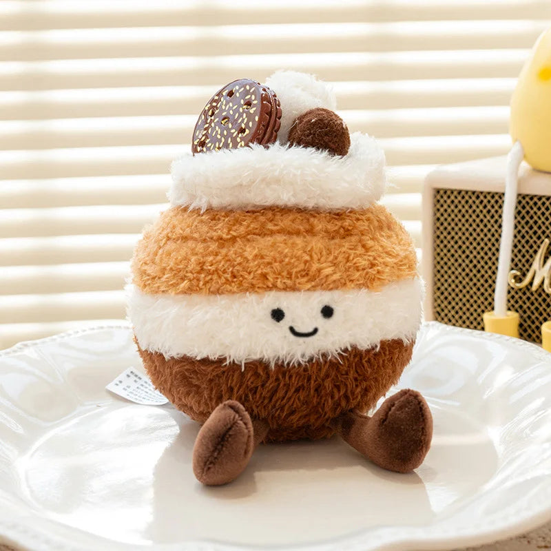Kawaii plush toy resembling a marshmallow with chocolate on top on a white surface.