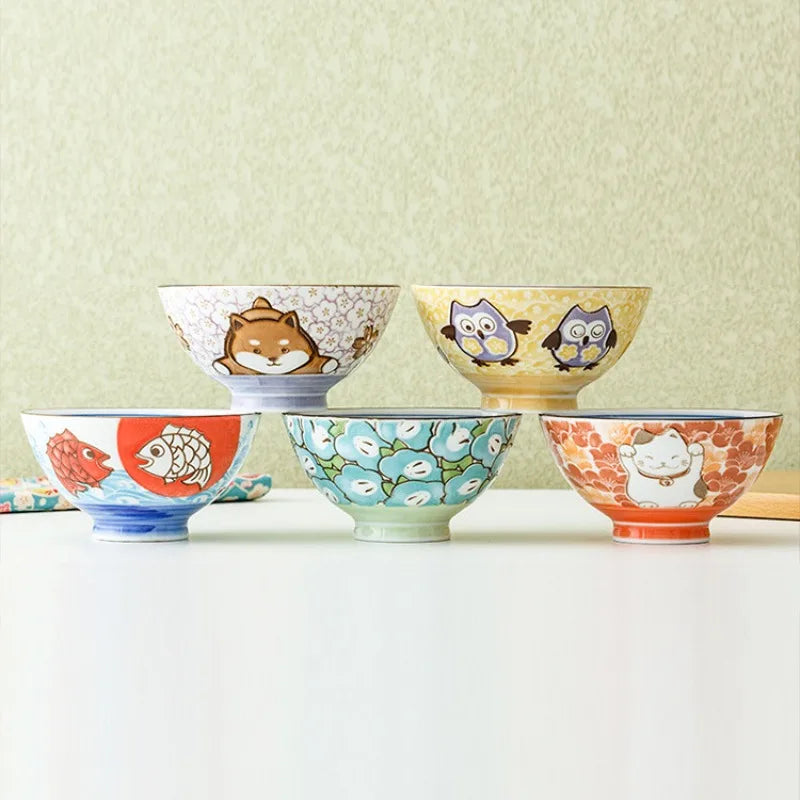 Set of colorful kawaii bowls with animal illustrations on a light background