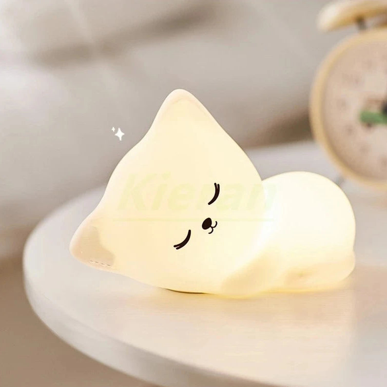 Heart-shaped kawaii night light with a smiley face on a blurred background