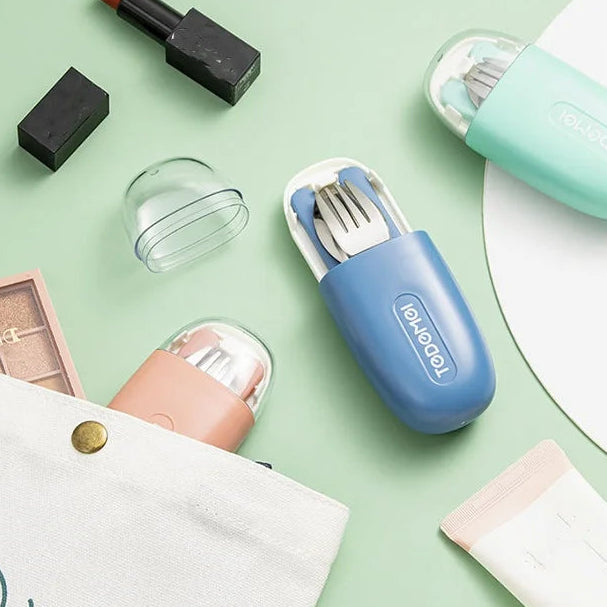 Blue travel kawaii utensils set with holder on a light green surface with various items.