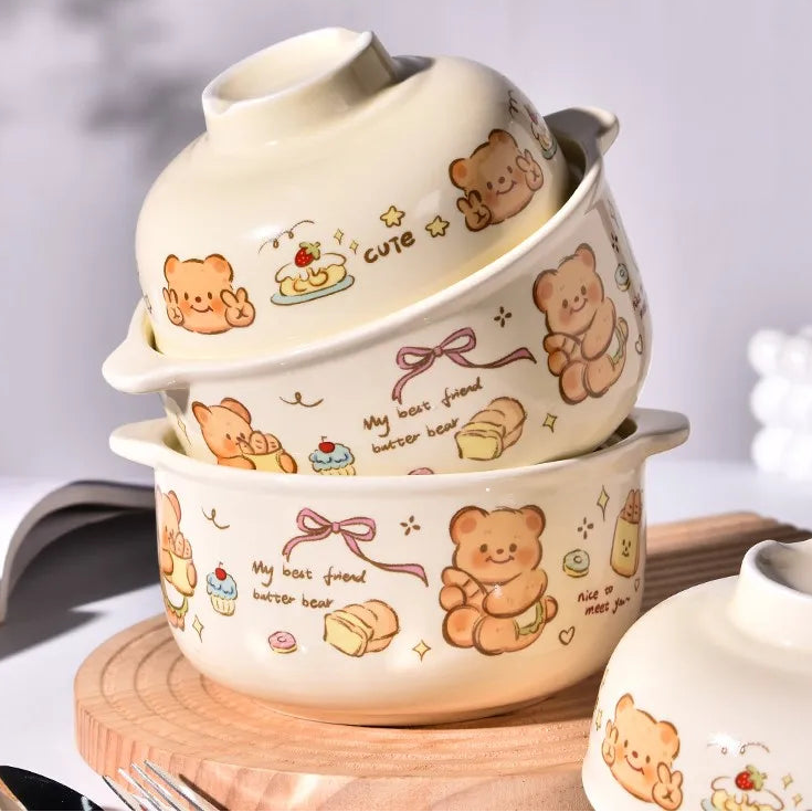 Set of three cartoon bear-themed ceramic kawaii ramen bowl on a wooden surface with a light gray background.