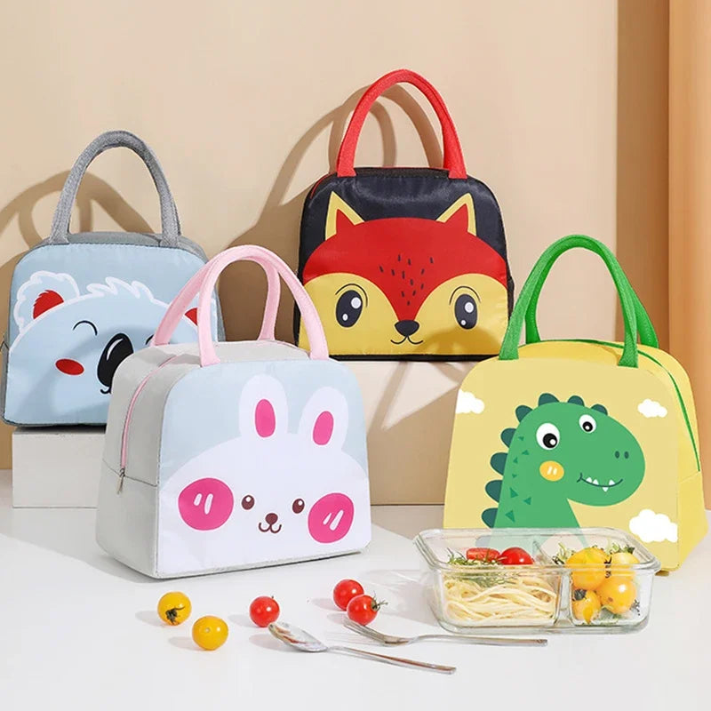 Set of colorful animal-themed kawaii lunch bags on a beige background