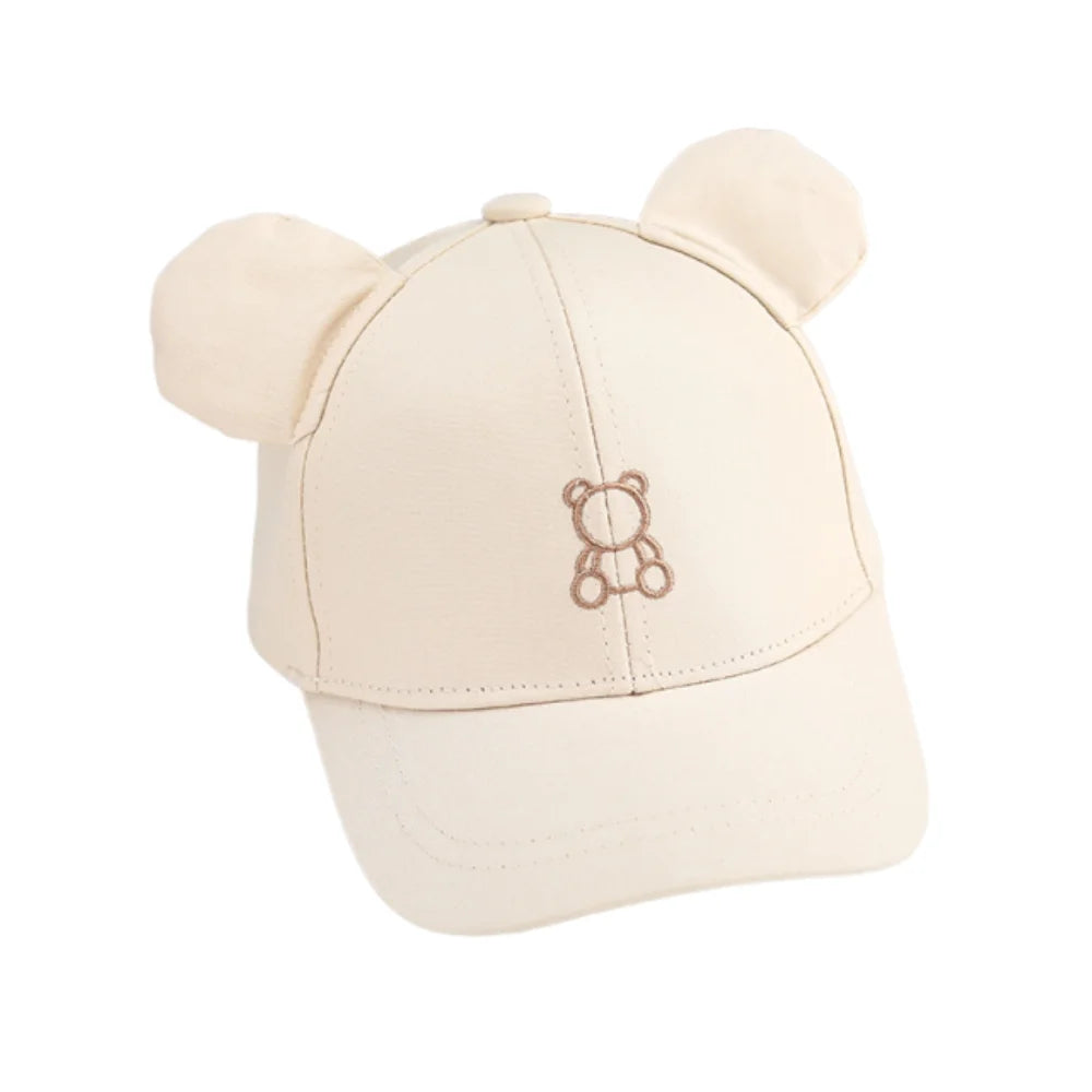 Beige cap with Kawaii bear ears and logo on a white background