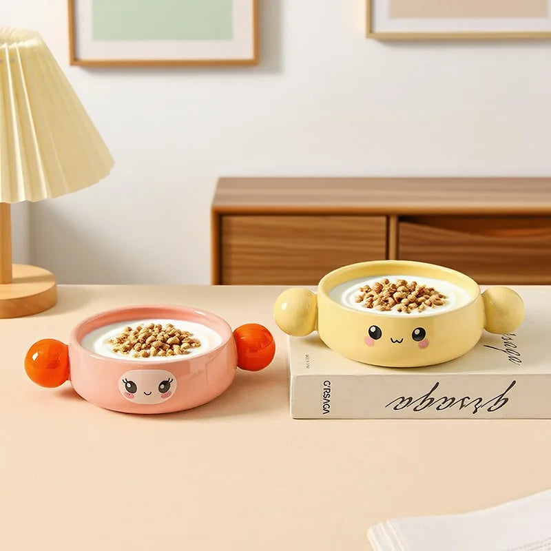 Two cartoon-style kawaii ramen bowls with faces filled with cereal on a table.