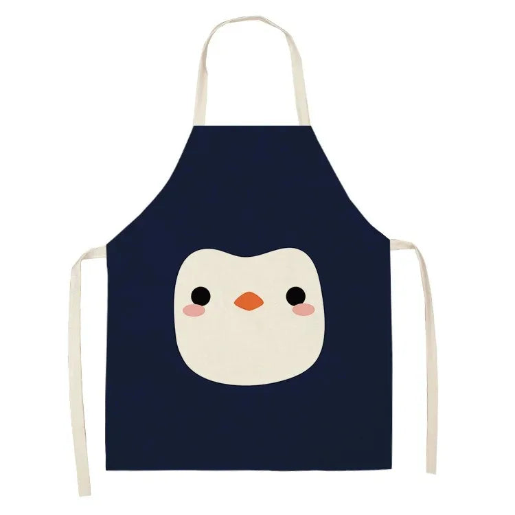 Navy blue kawaii apron with a cartoon penguin design on a white background