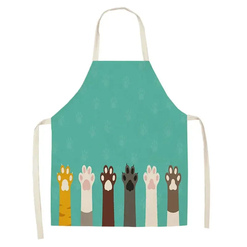 Teal apron with colorful Kawaii paw prints on a white background