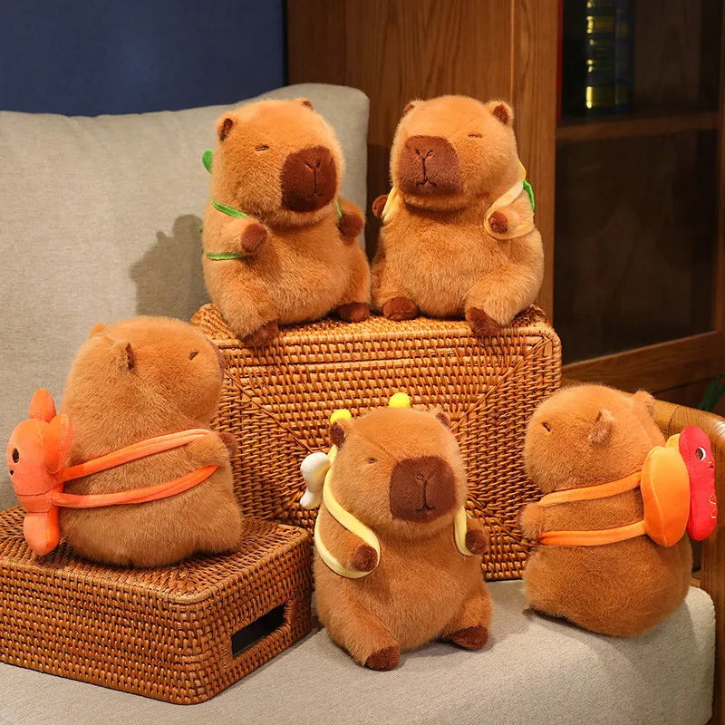 Set of brown kawaii plush toys resembling beavers on a woven box and chair.