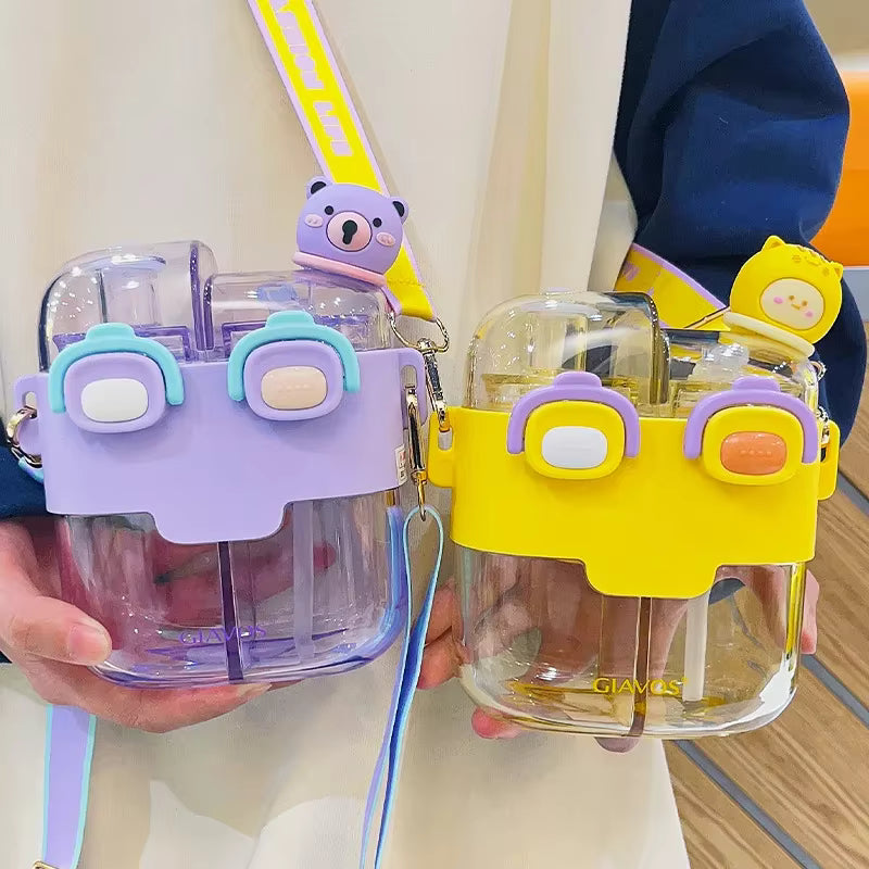 Two colorful kawaii water bottles with cartoon character holders held by a person.