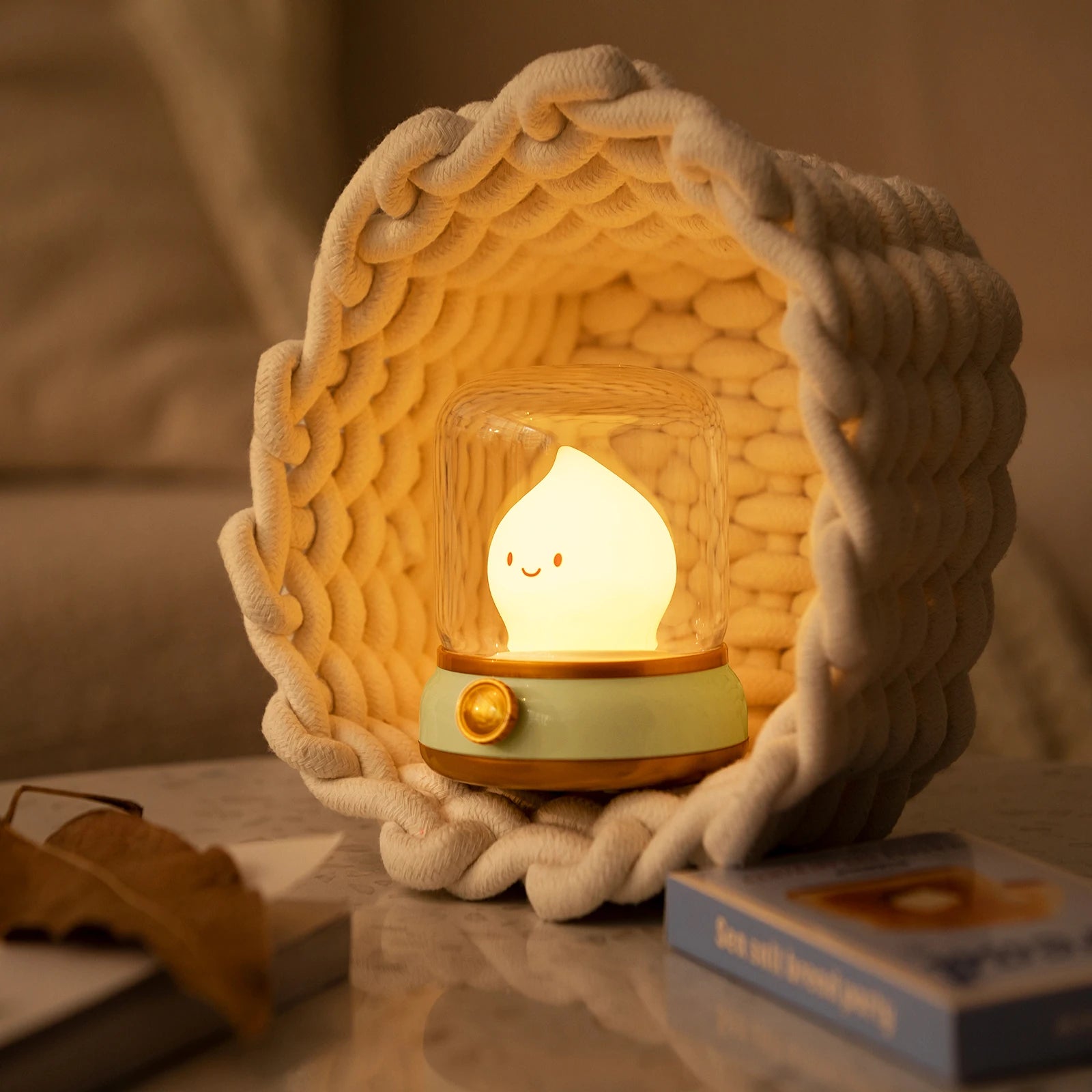 Woven basket with a glowing kawaii light inside on a table