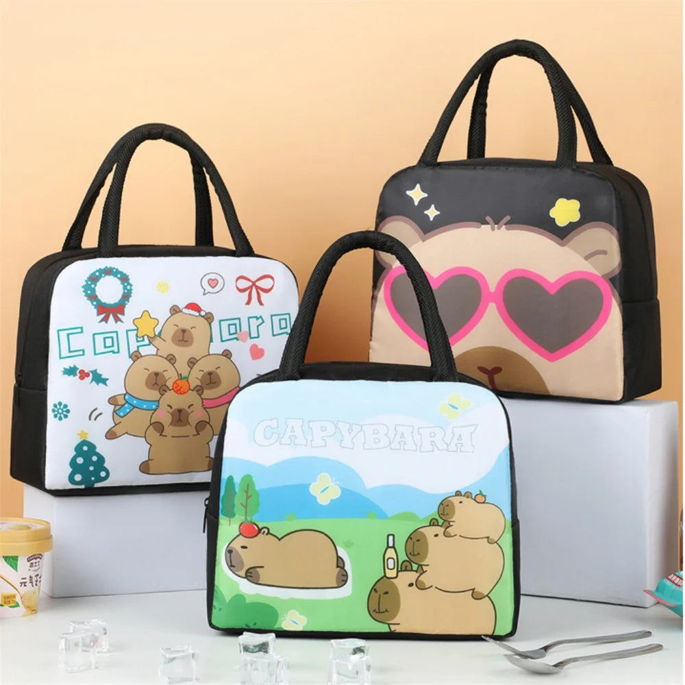 Three cartoon bear-themed kawaii lunch bags on a white surface with a beige background.