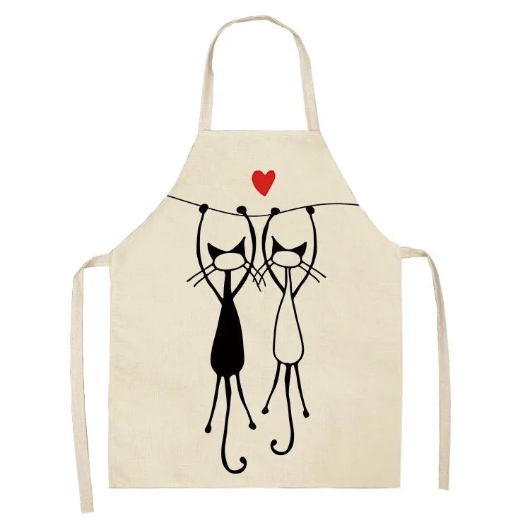 Beige apron with black cat Kawaii illustration and red heart on a white background