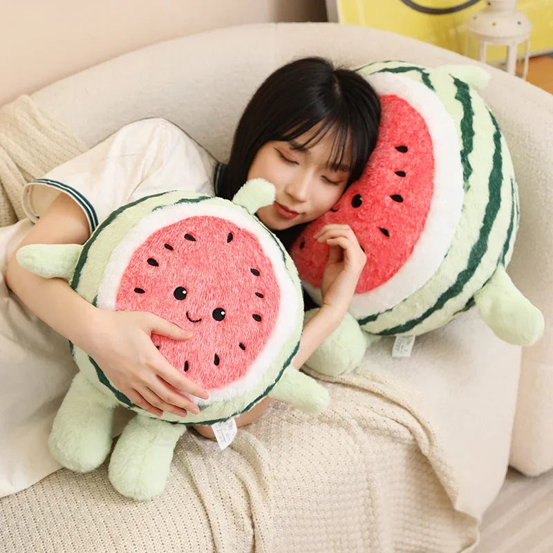 Person holding a kawaii plush watermelon toy on a couch