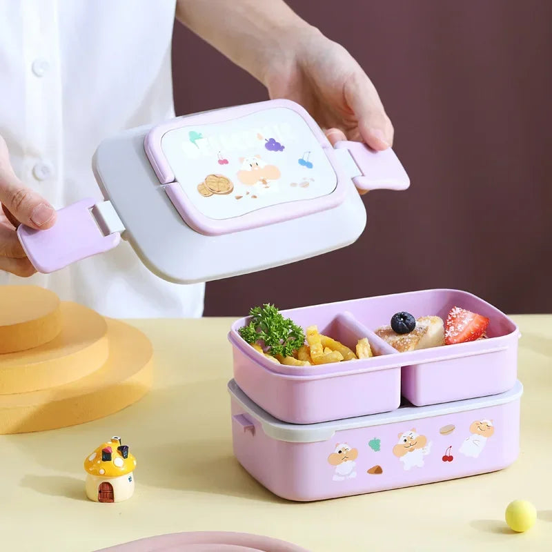 Pink kawaii bento box with food compartments on a yellow surface, with a person opening the lid.