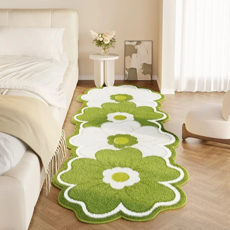 Green floral patterned kawaii rug on a wooden floor in a bedroom setting.