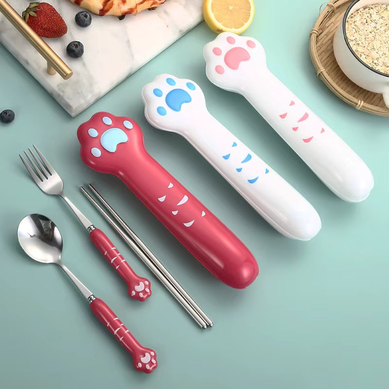 Set of colorful paw-shaped kawaii utensils on a light blue background with a fork, spoon, and chopsticks.
