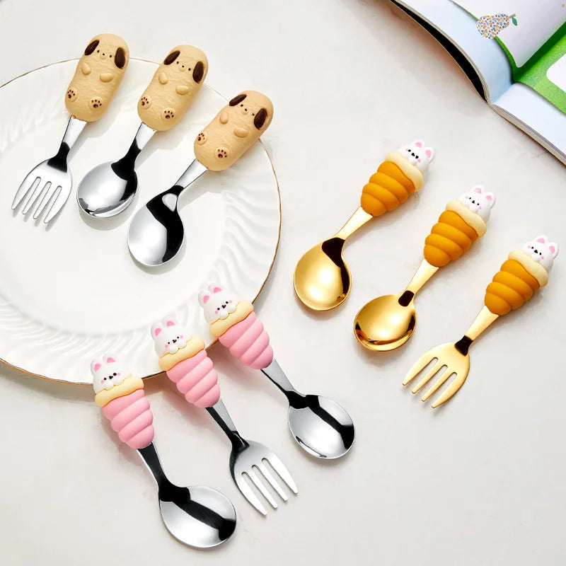 A set of three kawaii utensils shaped like dogs and cats